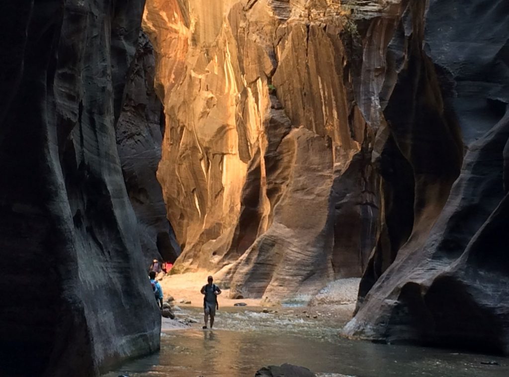 Early morning and you’re knee-deep in clear water, surrounded by sheer walls of red rock with only a breeze for company.