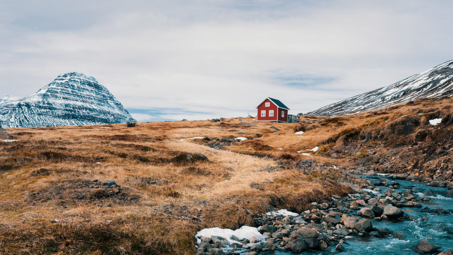 Standalone red house in the wilderness of Iceland