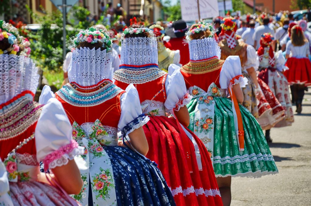 Women in handmade traditional costumes during the traditional parade in Moravia, Czech Republic.