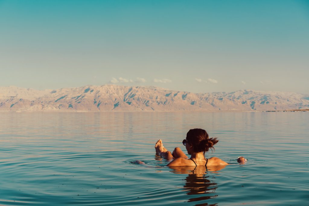 A woman floats and relaxes in the Dead Sea in Jordan
