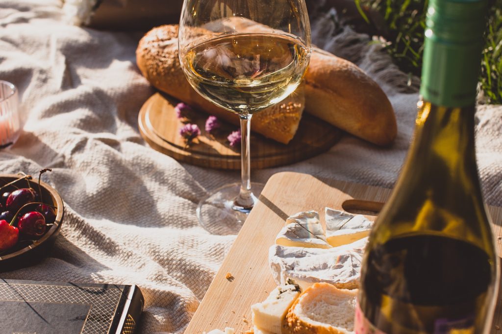 Enjoy French wine and cheese while in France.