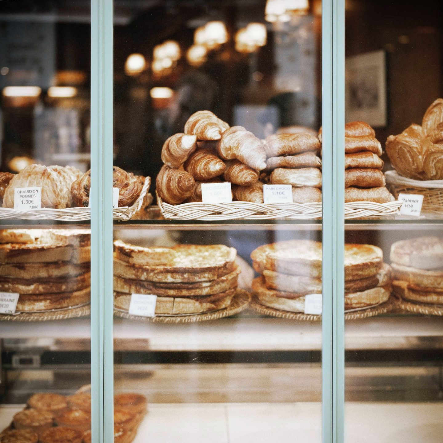 French pastry in the window of a bakery.