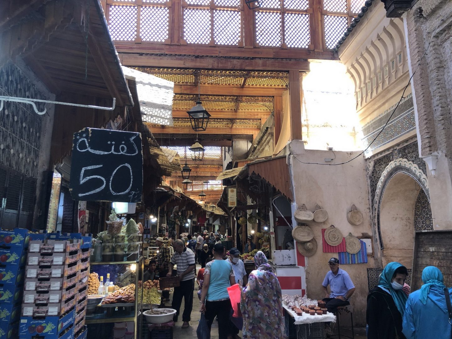 The souks in Fez, Morocco, are located in narrow streets and are crowded with people.