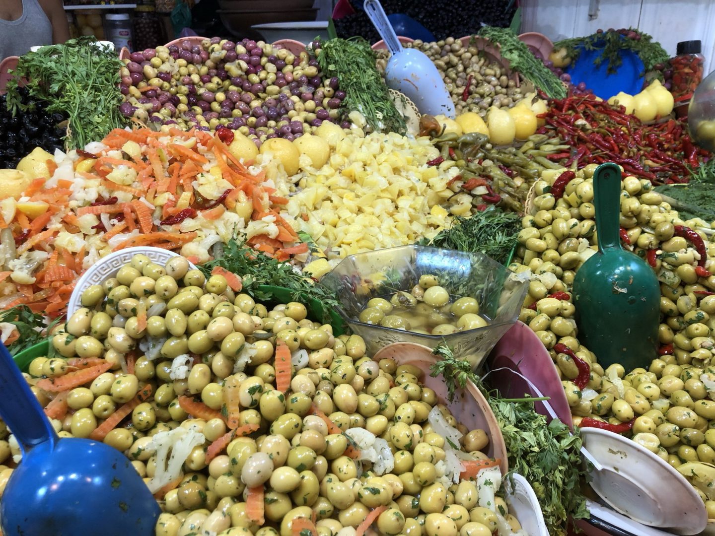 A food stall with fresh olives at the souk in Fez, Morocco.