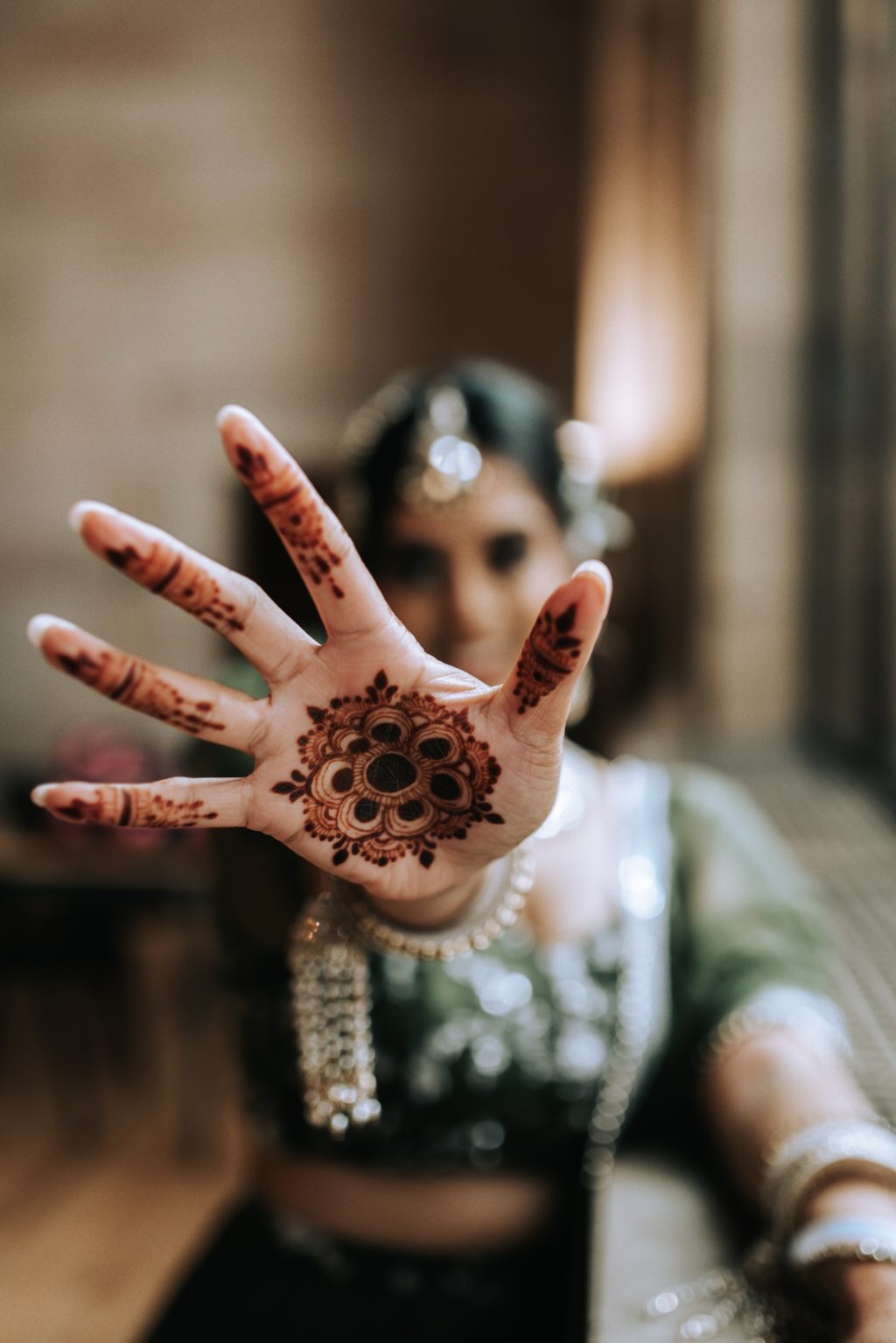 indian dancer with heena tattoo on hand