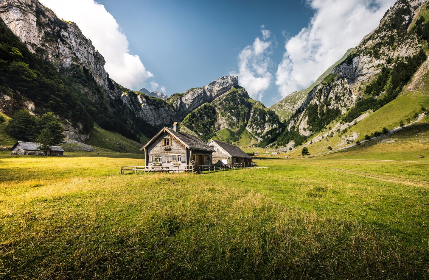 swiss hut surrounded by mountain