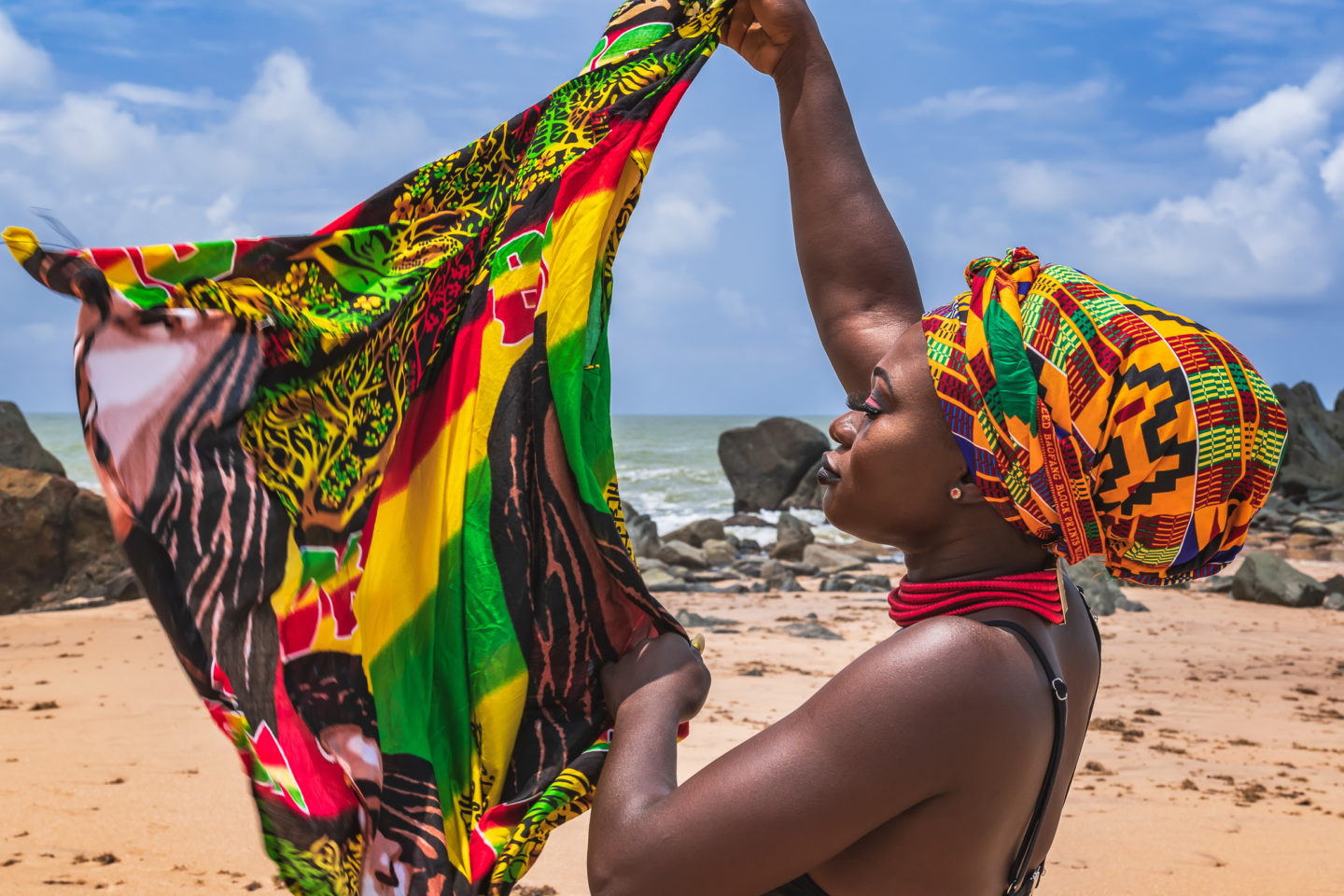 Dancing Ghana woman on the beautiful beach of Axim in Ghana.